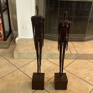 Pair of male and female metal sculpture. Redolent of Giacometti's Style